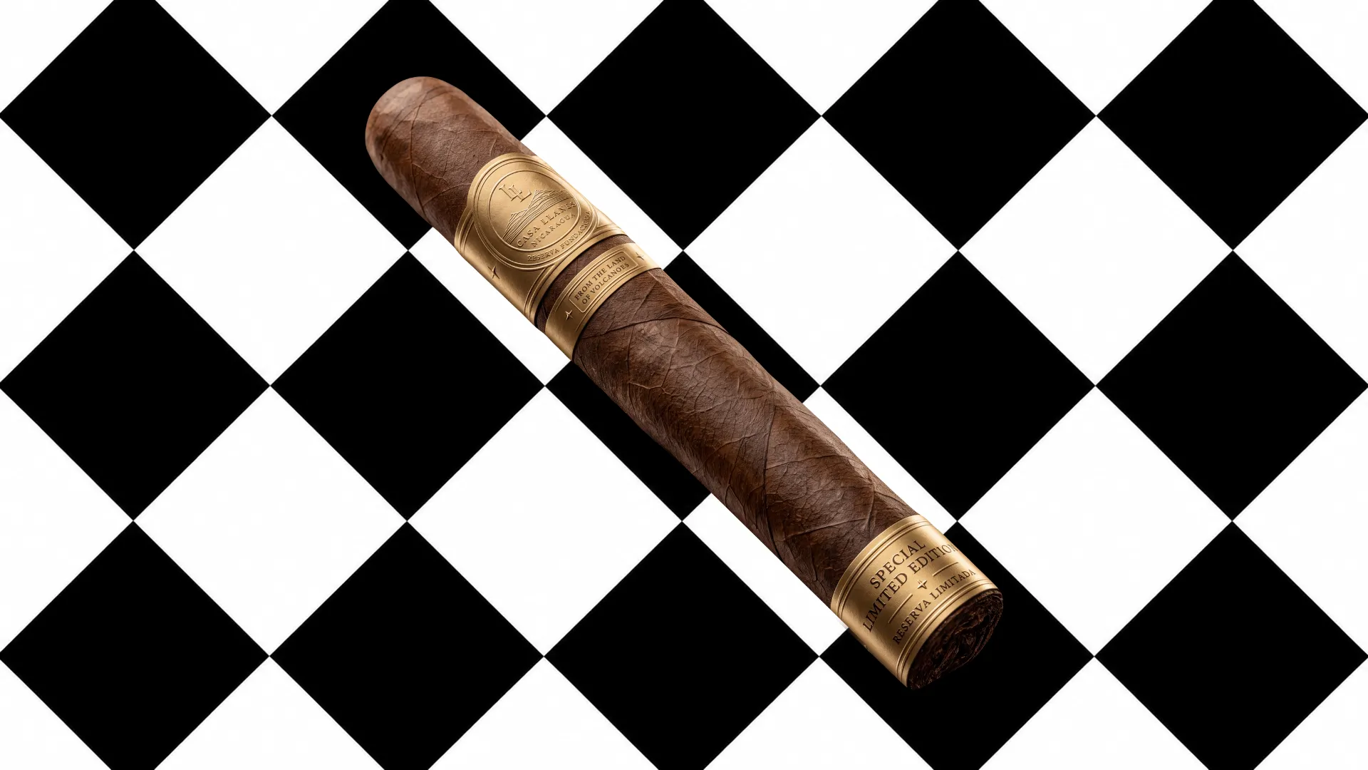 A CASA LLANES cigar resting on a black and white floor